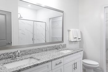Double sink vanity in bathrooms in select apartments